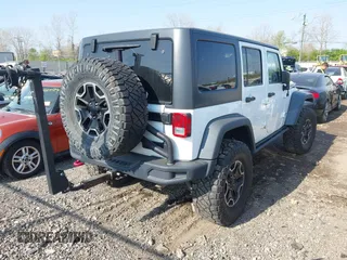 2015 Jeep Wrangler Unlimited Rubicon with VIN 1C4BJWFG1FL602412, listed as a IAAI auction lot 42065619 with 109,070 mi miles. Bid and sale history available at carsss.com. Image 4.