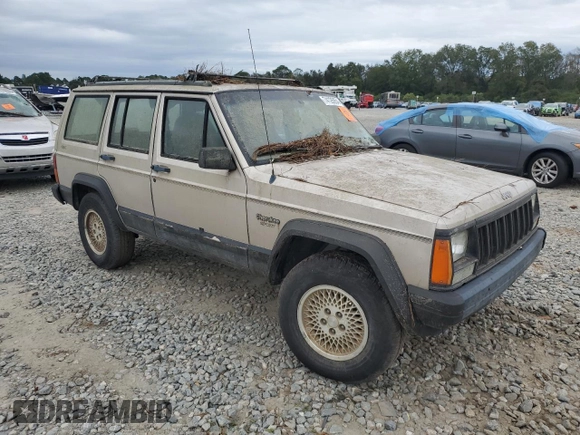 1995 Jeep Cherokee Sport with VIN 1J4FJ68S4SL618773, listed as a Copart auction lot 74126954 with 318,519 mi miles and Salvage title. Bid and sale history available at DreamBid. Image 4.