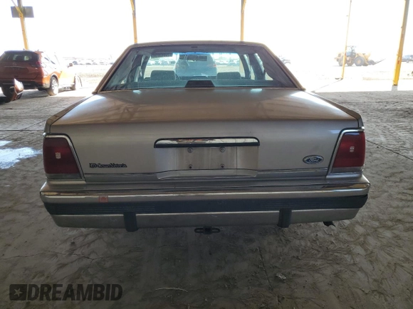 1990 Ford Crown Victoria z VIN 2FACP73F9LX166174, wystawiony jako Copart lot #76043234 z przebiegiem 52 545 mil mil oraz Szkoda całkowita • Salvage title. Historia ofert i sprzedaży dostępna na DreamBid. Obrazek 6.