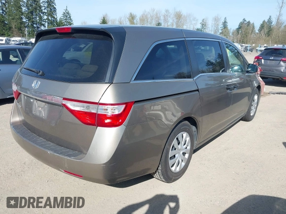 2013 Honda Odyssey LX z VIN 5FNRL5H29DB055166, wystawiony jako IAAI lot #41965037 z przebiegiem 122 470 mil mil oraz . Historia ofert i sprzedaży dostępna na DreamBid. Obrazek 4.