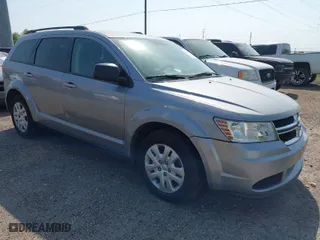 2016 Dodge Journey SE with VIN 3C4PDCAB0GT127980, listed as a IAAI auction lot 41971310 with 207,644 mi miles. Bid and sale history available at carsss.com. Image 1.
