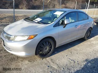2012 Honda Civic Sdn LX with VIN 2HGFB2F57CH319433, listed as a IAAI auction lot 41536201 with 135,514 mi miles. Bid and sale history available at carsss.com. Image 2.