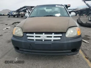 2004 Hyundai Accent GL with VIN KMHCG45C34U567915, listed as a Copart auction lot 43654985 with 141,461 mi miles and Clean Title. Bid and sale history available at carsss.com. Image 5.