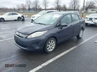 2012 Ford Fiesta SE with VIN 3FADP4BJ0CM155729, listed as a IAAI auction lot 41800447 with 90,091 mi miles. Bid and sale history available at carsss.com. Image 2.