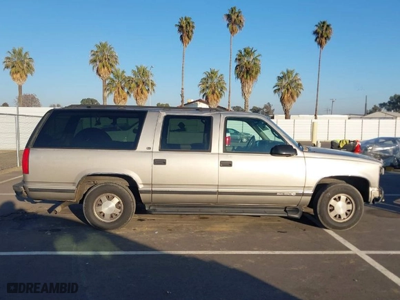 1999 GMC Suburban with VIN 1GKEC16R8XJ737397, listed as a IAAI auction lot 41301399 with NaN miles. Bid and sale history available at carsss.com. Image 14.