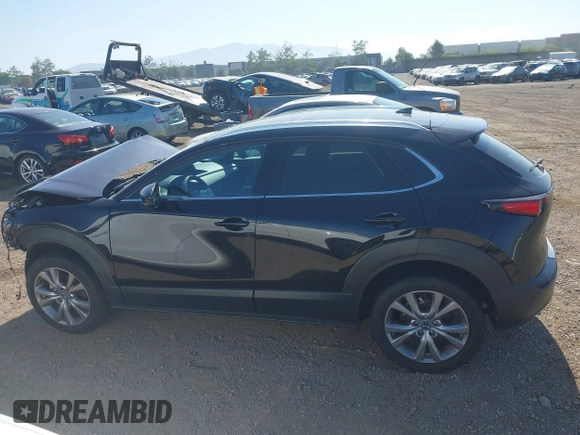 2022 Mazda CX-30 S Premium with VIN 3MVDMBDL6NM407913, listed as a IAAI auction lot 42359860 with 35,804 mi miles and . Bid and sale history available at DreamBid. Image 15.