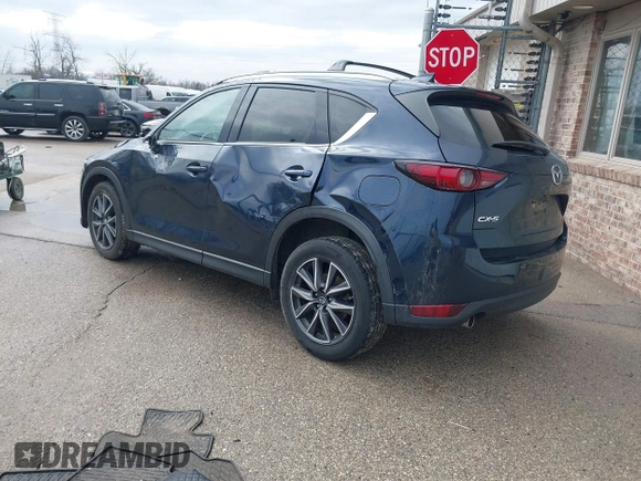 2018 Mazda CX-5 Grand Touring with VIN JM3KFADM1J1439544, listed as a IAAI auction lot 41891134 with 54,132 mi miles and . Bid and sale history available at DreamBid. Image 3.