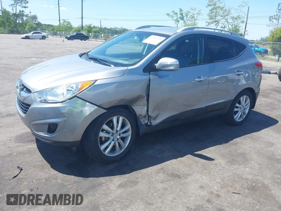 2013 Hyundai Tucson GLS with VIN KM8JU3AC4DU588062, listed as a IAAI auction lot 42080348 with 76,937 mi miles. Bid and sale history available at carsss.com. Image 17.