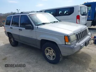 1996 Jeep Grand Cherokee Laredo with VIN 1J4EX58S1TC122268, listed as a IAAI auction lot 42005236 with 288,466 mi miles. Bid and sale history available at carsss.com. Image 1.
