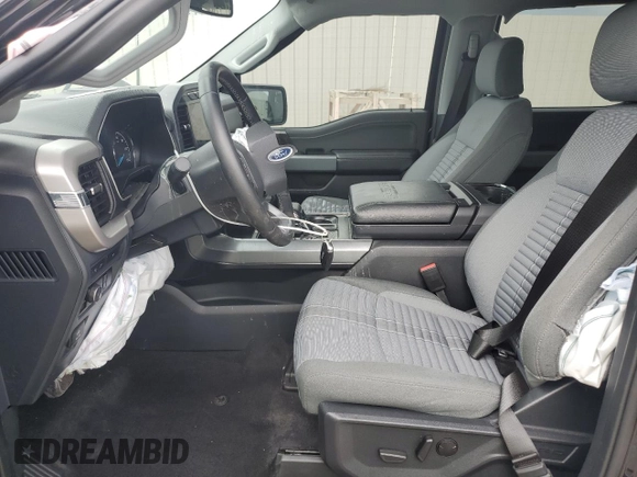 2023 Ford F-150 XL with VIN 1FTFW1E84PKE35275, listed as a Copart auction lot 61867535 with 22,142 mi miles and Salvage title. Bid and sale history available at DreamBid. Image 7.