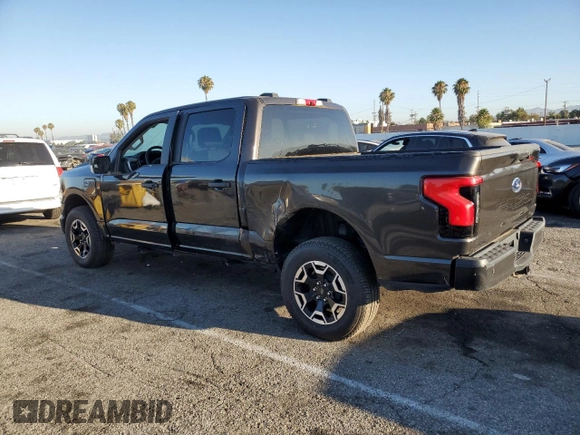 2023 Ford F-150 Lightning Pro with VIN 1FTVW1EL7PWG11261, listed as a Copart auction lot 64088925 with 3,288 mi miles and Salvage title. Bid and sale history available at DreamBid. Image 2.