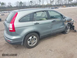 2011 Honda CR-V LX with VIN 5J6RE3H37BL008665, listed as a IAAI auction lot 42060005 with 128,447 mi miles. Bid and sale history available at carsss.com. Image 4.