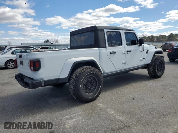 2023 Jeep Gladiator Sport S with VIN 1C6HJTAG4PL556387, listed as a Copart auction lot 47453305 with 35,611 mi miles and Salvage title. Bid and sale history available at DreamBid. Image 3.
