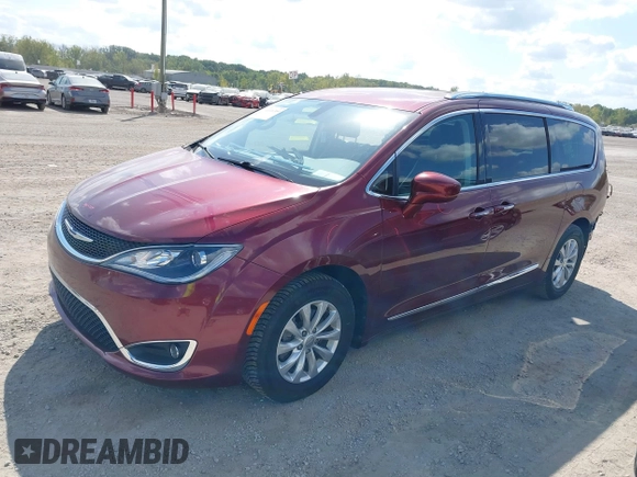 2018 Chrysler Pacifica Touring L with VIN 2C4RC1BG0JR279665, listed as a IAAI auction lot 40336389 with 80,835 mi miles and . Bid and sale history available at DreamBid. Image 2.