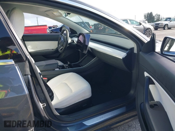 2020 Tesla Model 3 Standard Range Plus with VIN 5YJ3E1EA0LF744046, listed as a IAAI auction lot 41939894 with 102,576 mi miles. Bid and sale history available at carsss.com. Image 5.