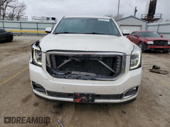 2015 GMC Yukon Denali with VIN 1GKS1CKJ1FR619793, listed as a Copart auction lot 86910314 with 128,559 mi miles and Salvage Title. Bid and sale history available at carsss.com. Image 5.
