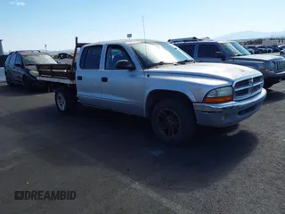2003 Dodge Dakota SLT with VIN 1D7HL48N33S295059, listed as a IAAI auction lot 42085612 with 176,934 mi miles. Bid and sale history available at carsss.com. Image 1.
