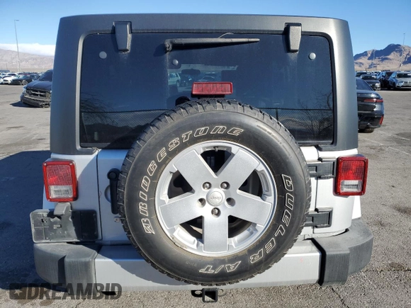 2007 Jeep Wrangler Unlimited Sahara with VIN 1J4GB59197L144781, listed as a Copart auction lot 48678315 with 137,538 mi miles and Salvage title. Bid and sale history available at DreamBid. Image 6.