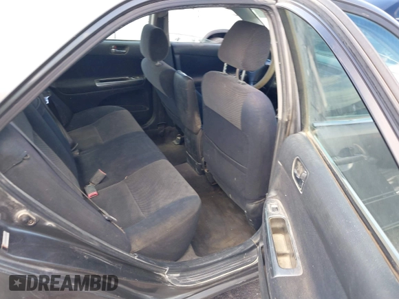 2003 Toyota Camry LE with VIN JTDBE32K130149032, listed as a IAAI auction lot 42063174 with 241,424 mi miles and . Bid and sale history available at DreamBid. Image 8.