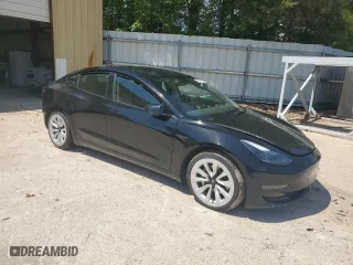 2023 Tesla Model 3 with VIN 5YJ3E1EA2PF438438, listed as a Copart auction lot 52901375 with 63,181 mi miles and Salvage Title. Bid and sale history available at carsss.com. Image 4.