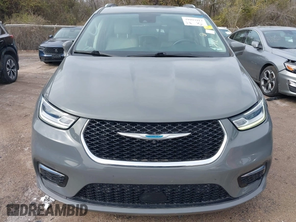 2021 Chrysler Pacifica Hybrid Touring L z VIN 2C4RC1L78MR596371, wystawiony jako IAAI lot #39993913 z przebiegiem 64 830 mil mil oraz . Historia ofert i sprzedaży dostępna na DreamBid. Obrazek 12.