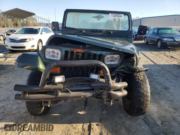 1995 Jeep Wrangler Sahara with VIN 1J4FY49S6SP272569, listed as a Copart auction lot 77839534 with 162,080 mi miles and Salvage Title. Bid and sale history available at carsss.com. Image 5.