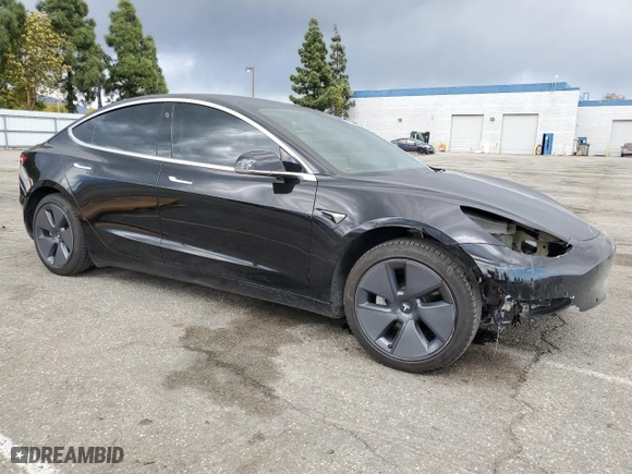 2020 Tesla Model 3 Standard Range Plus with VIN 5YJ3E1EA1LF630136, listed as a Copart auction lot 51306355 with 51,910 mi miles and Salvage Title. Bid and sale history available at carsss.com. Image 4.