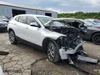 2021 BMW X2 xDrive28i with VIN WBXYJ1C08M5T00852, listed as a Copart auction lot 58498864 with 59,460 mi miles and Salvage Title. Bid and sale history available at carsss.com. Image 4.