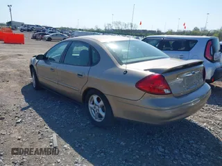 2003 Ford Taurus SE Standard with VIN 1FAFP53U73A245044, listed as a IAAI auction lot 41999582 with 85,870 mi miles. Bid and sale history available at carsss.com. Image 3.