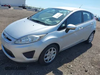 2013 Ford Fiesta SE with VIN 3FADP4EJ9DM157685, listed as a IAAI auction lot 42145511 with 101,331 mi miles. Bid and sale history available at carsss.com. Image 2.