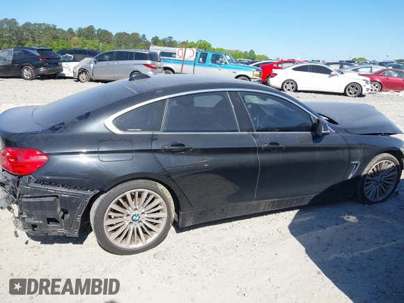 2015 BMW 4 Series 428i with VIN WBA4A5C51FG051393, listed as a IAAI auction lot 42041960 with 136,929 mi miles and . Bid and sale history available at carsss.com. Image 13.