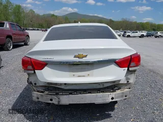 2014 Chevrolet Impala LT with VIN 2G1125S32E9267584, listed as a IAAI auction lot 42079857 with 144,812 mi miles and . Bid and sale history available at DreamBid. Image 17.