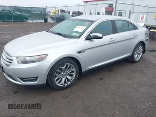 2014 Ford Taurus Limited with VIN 1FAHP2F81EG123933, listed as a IAAI auction lot 41843301 with 111,629 mi miles. Bid and sale history available at carsss.com. Image 2.