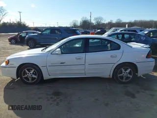 2001 Pontiac Grand Am GT with VIN 1G2NW52E11C244447, listed as a IAAI auction lot 41697883 with 81,983 mi miles. Bid and sale history available at carsss.com. Image 14.