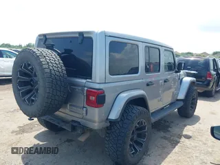 2021 Jeep Wrangler Unlimited High Altitude with VIN 1C4HJXEG3MW511185, listed as a IAAI auction lot 42125883 with 45,564 mi miles and . Bid and sale history available at DreamBid. Image 4.