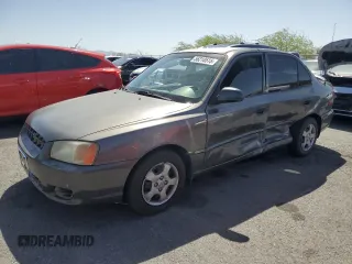 2001 Hyundai Accent GL z VIN KMHCG45C91U186811, wystawiony jako Copart lot #56210515 z przebiegiem 79 730 mil mil oraz Szkoda całkowita • Salvage title. Historia ofert i sprzedaży dostępna na DreamBid. Obrazek 1.