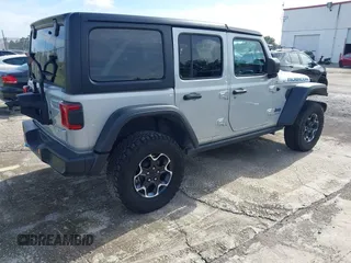 2023 Jeep Wrangler Rubicon with VIN 1C4JJXR63PW703424, listed as a IAAI auction lot 42639653 with 46,412 mi miles and . Bid and sale history available at DreamBid. Image 4.