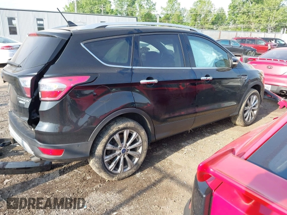2018 Ford Escape Titanium with VIN 1FMCU9J95JUB30803, listed as a IAAI auction lot 42286536 with 63,309 mi miles and . Bid and sale history available at DreamBid. Image 4.