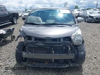 2012 Scion iQ with VIN JTNJJXB00CJ018659, listed as a IAAI auction lot 42232715 with 142,516 mi miles and . Bid and sale history available at DreamBid. Image 13.