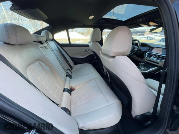 2021 BMW 3 Series 330i with VIN 3MW5R1J04MBB48483, listed as a Copart auction lot 50515195 with 128,555 mi miles and Clean Title. Bid and sale history available at carsss.com. Image 6.