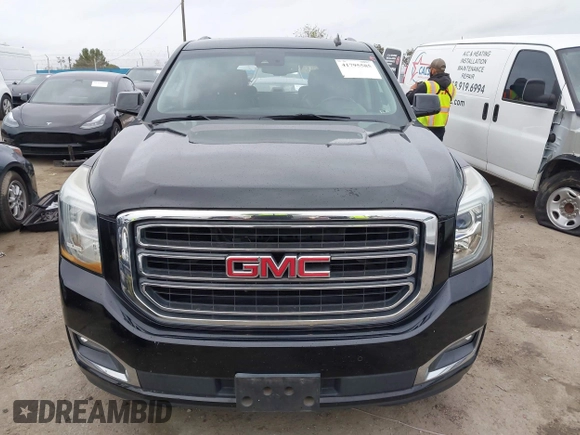 2015 GMC Yukon SLT with VIN 1GKS1BKC3FR129173, listed as a IAAI auction lot 41795585 with 97,893 mi miles. Bid and sale history available at carsss.com. Image 13.