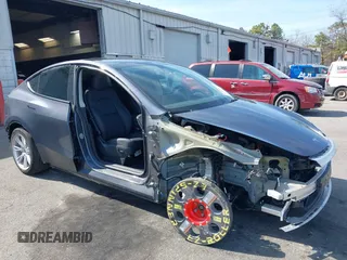 2023 Tesla Model Y Long Range with VIN 7SAYGDEE7PF856985, listed as a IAAI auction lot 42097675 with 13,112 mi miles and . Bid and sale history available at DreamBid. Image 6.