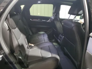 2025 Cadillac XT5 AWD Premium Luxury z VIN 1GYKNDRS0SZ119763, wystawiony jako Copart lot #57577715 z przebiegiem 10 682 mil mil oraz Tytuł czysty. Historia ofert i sprzedaży dostępna na DreamBid. Obrazek 11.