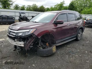 2017 Honda Pilot Touring z VIN 5FNYF6H90HB030457, wystawiony jako Copart lot #57235055 z przebiegiem 156 435 mil mil oraz Szkoda całkowita • Salvage title. Historia ofert i sprzedaży dostępna na DreamBid. Obrazek 1.