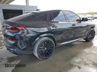2023 BMW X6 M50i with VIN 5UXCY8C01P9S00552, listed as a Copart auction lot 84193154 with 16,590 mi miles and Salvage Title. Bid and sale history available at carsss.com. Image 3.