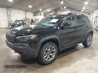 2022 Jeep Cherokee Trailhawk with VIN 1C4PJMBX8ND517236, listed as a IAAI auction lot 41530369 with 34,164 mi miles and . Bid and sale history available at DreamBid. Image 2.