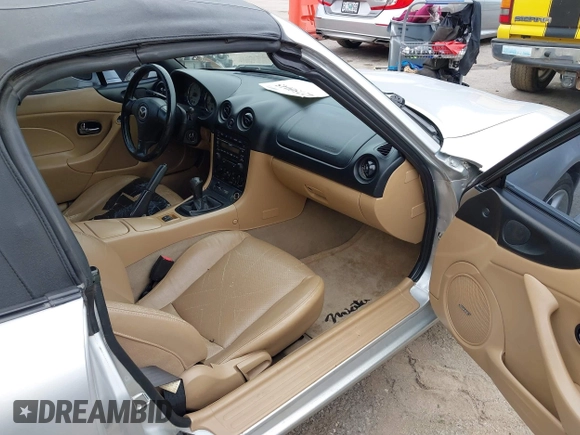 2002 Mazda MX-5 Miata Cloth with VIN JM1NB353820229890, listed as a IAAI auction lot 42750045 with 116,227 mi miles and . Bid and sale history available at DreamBid. Image 5.