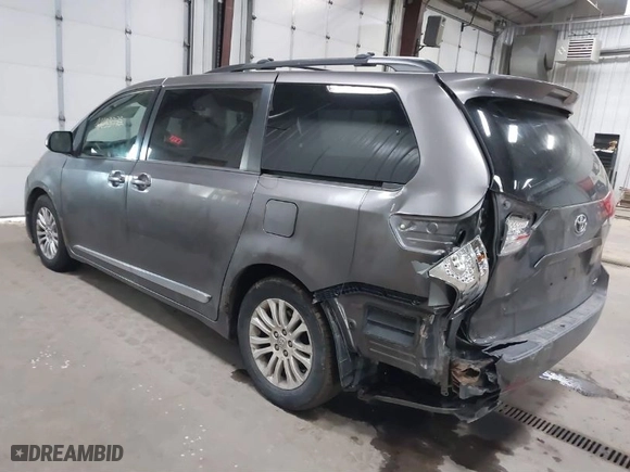 2012 Toyota Sienna XLE AAS with VIN 5TDYK3DC9CS268758, listed as a IAAI auction lot 41613513 with 214,601 mi miles. Bid and sale history available at carsss.com. Image 3.