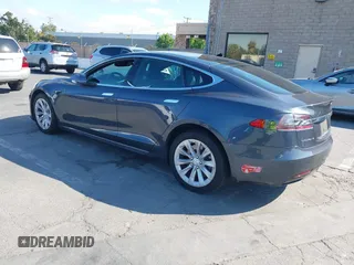 2018 Tesla Model S 75D with VIN 5YJSA1E26JF249573, listed as a IAAI auction lot 42748801 with 88,467 mi miles and . Bid and sale history available at DreamBid. Image 3.