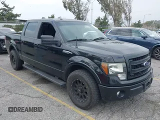 2014 Ford F-150 XL with VIN 1FTFW1CF0EFA45457, listed as a IAAI auction lot 41447000 with 169,984 mi miles. Bid and sale history available at carsss.com. Image 1.